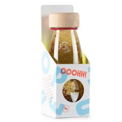 Botella sensorial flotante transparente y dorado Float Bottle - Petit Boum