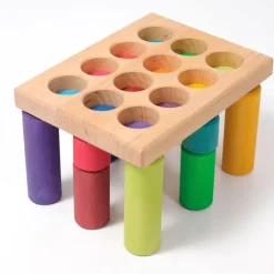Cilindros de madera para encajar y construir colores arcoíris (12) - Grimm's