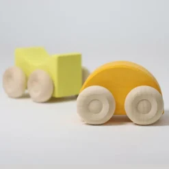 Coches de madera apilables amarillos (2) - Grimm's