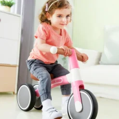 Triciclo correpasillos rosa pastel - Hape